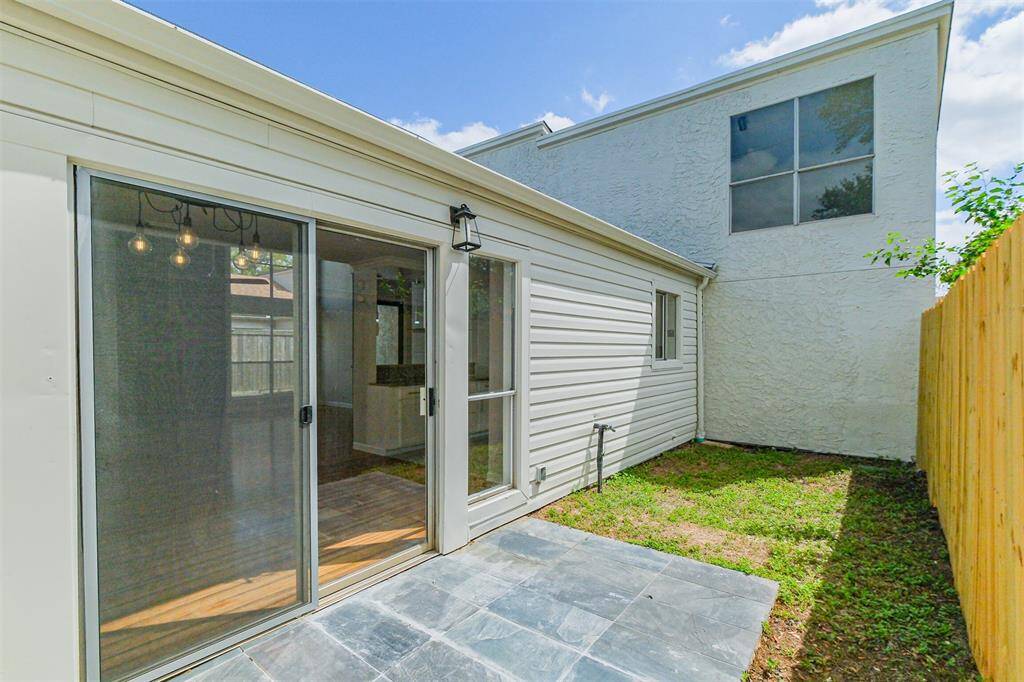 The side patio off the dining room is perfect for placing your favorite grill.