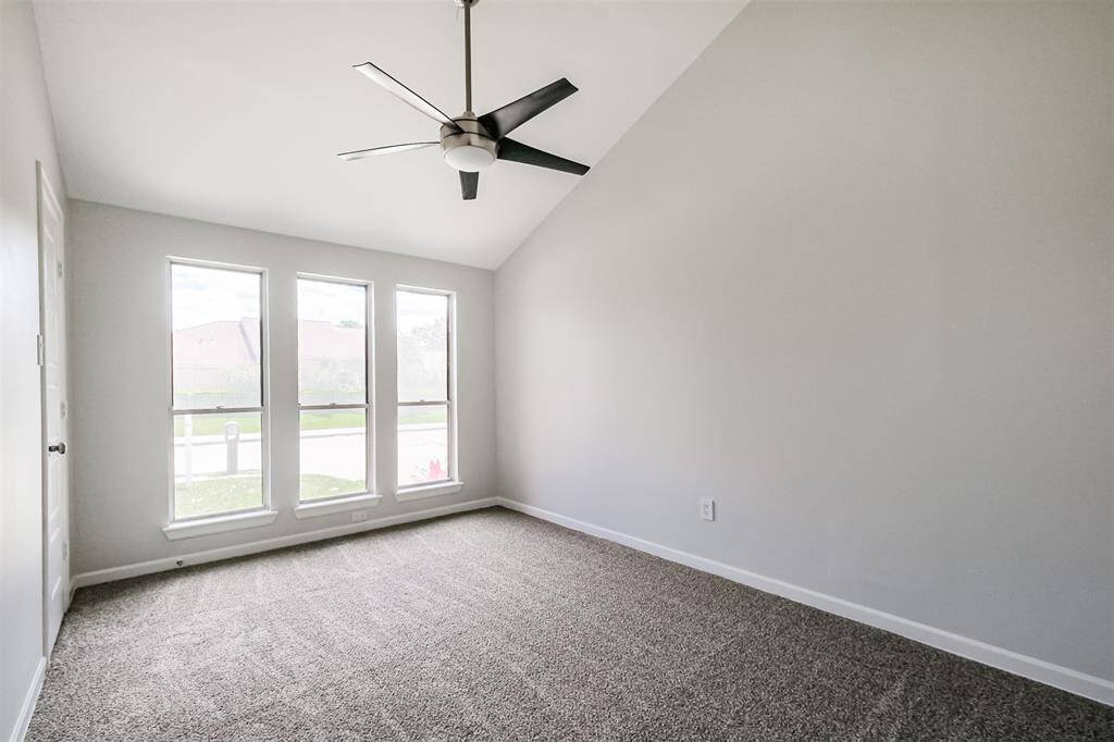 The third bedroom has recent carpet floors (2025, high ceilings, a ceiling fan and walk-in closet.