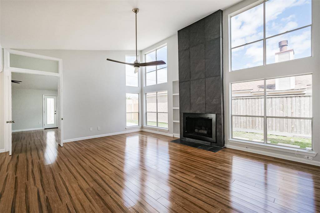 As soon as you walk through the doors you are greeted by laminate floors and a wall of windows in the den.