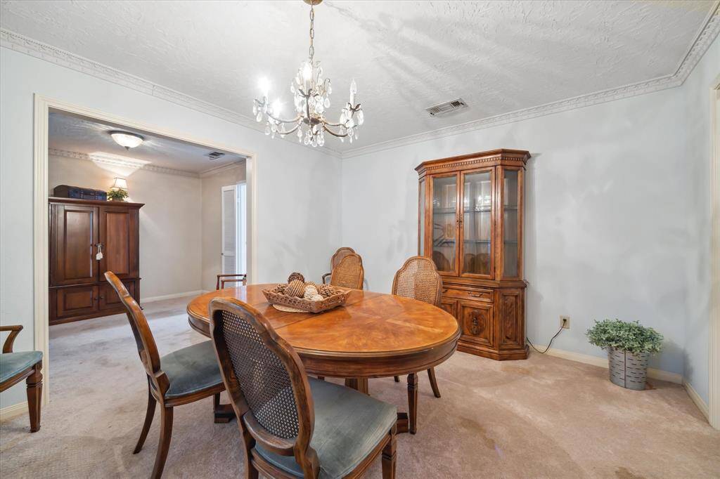 Large Formal Dining Room with open flow to a second living area.
