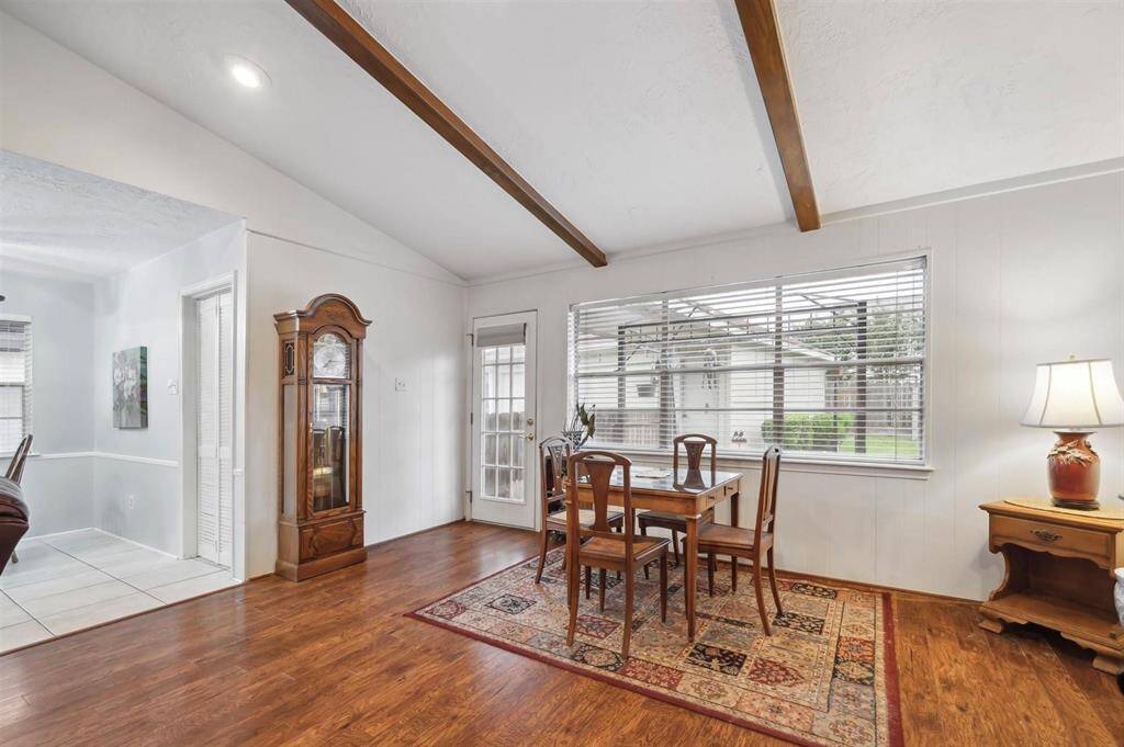 View of the Back entry door that leads to Backyard living and walk way leading to the detached garage.