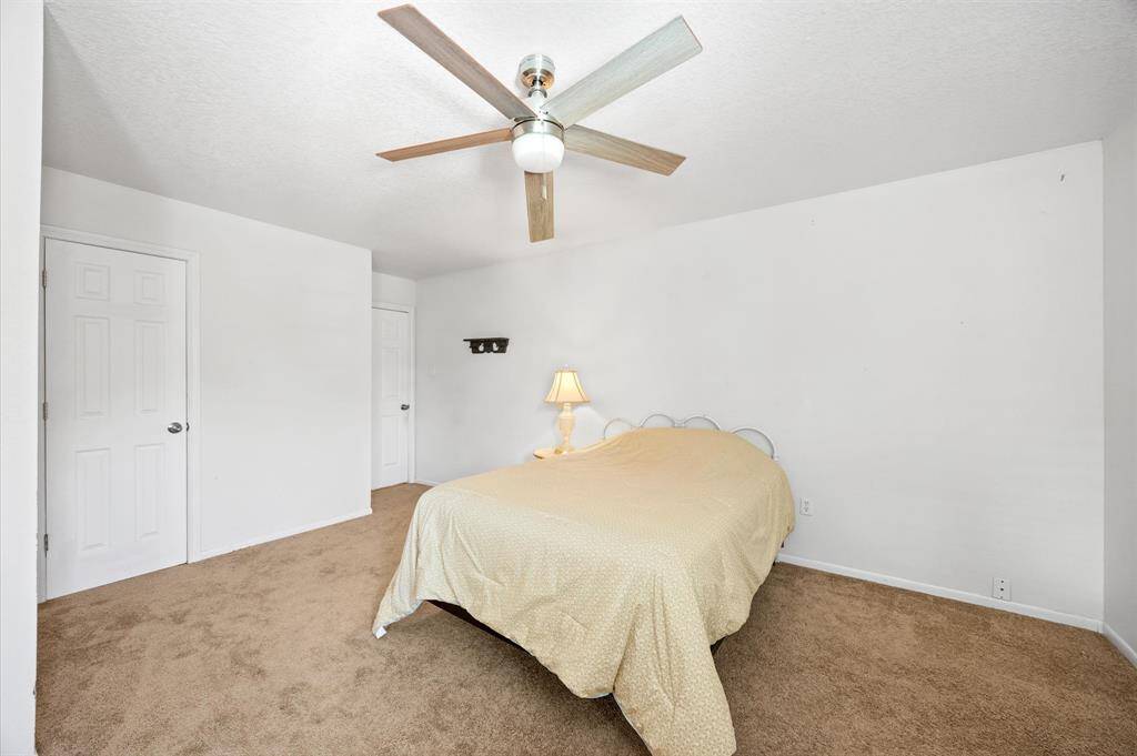 This second-floor bedroom offers a blank canvas, perfect for adding your personal touch.