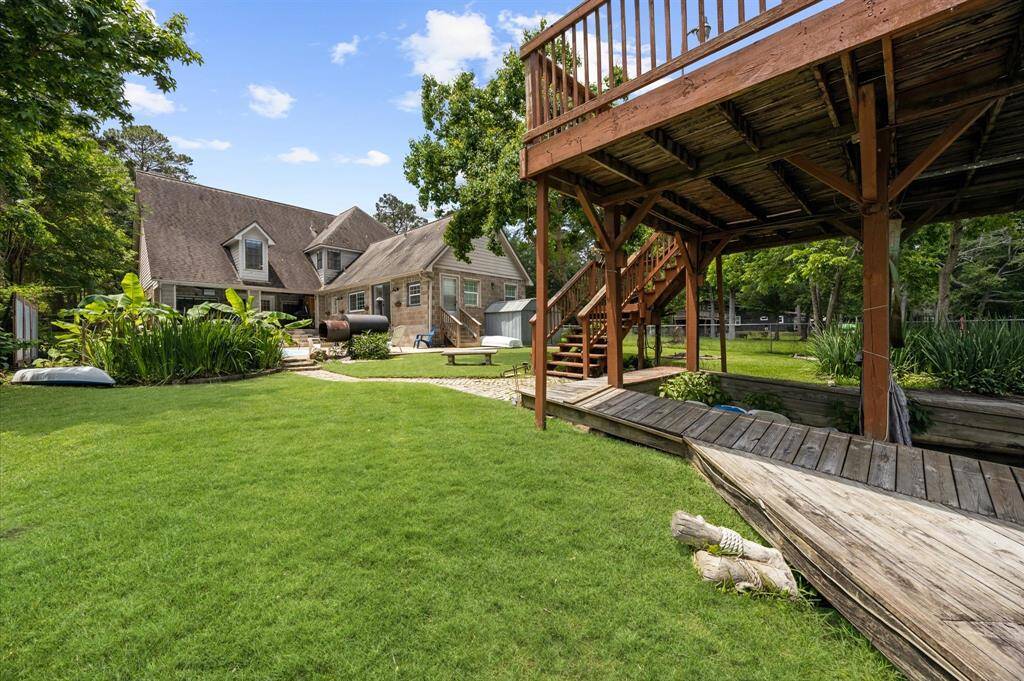 Stunning views from the deck and unwind in a cozy seating area surrounded by lush, manicured landscaping.