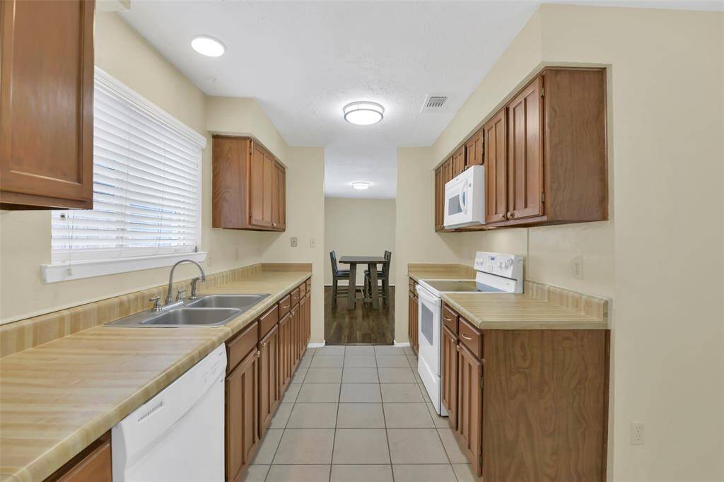Another view of the kitchen with plenty of light