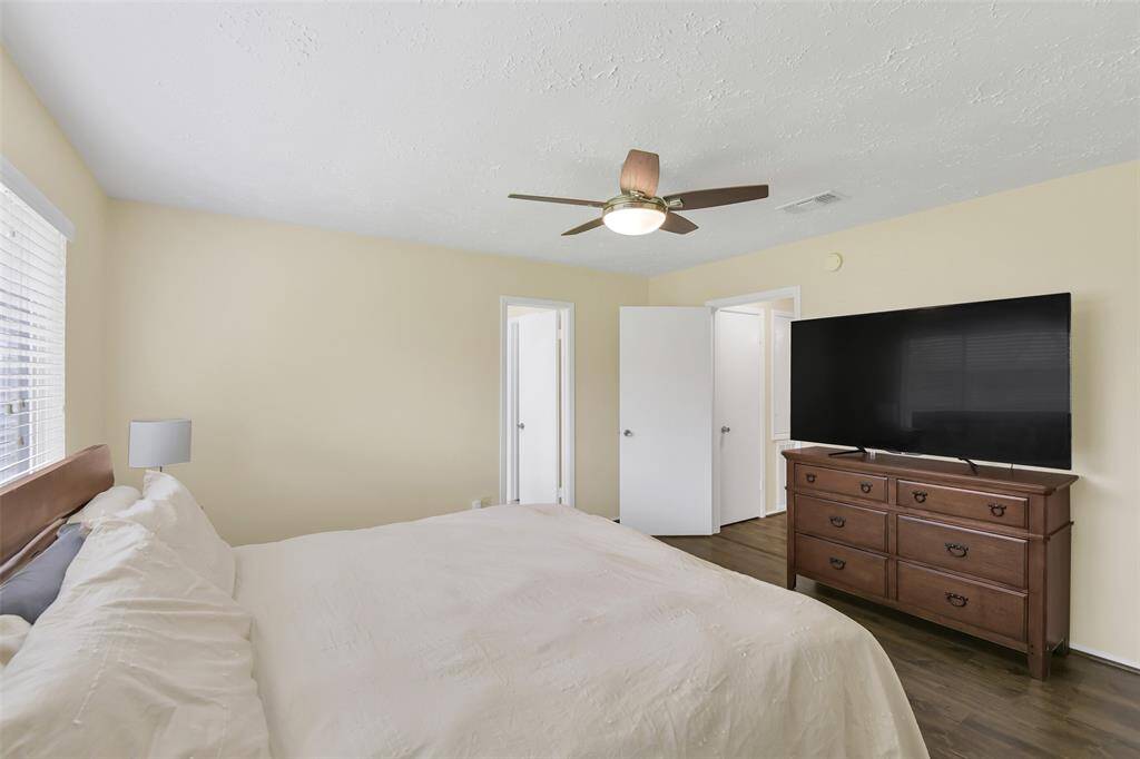 Another view of the primary bedroom