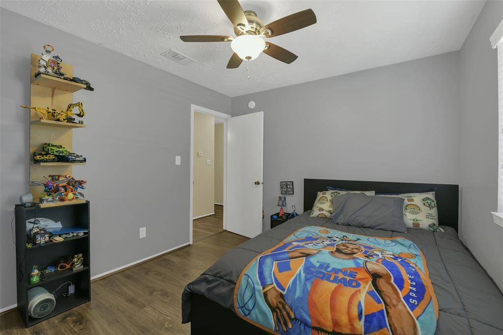 Second bedroom with beautiful wood like floors