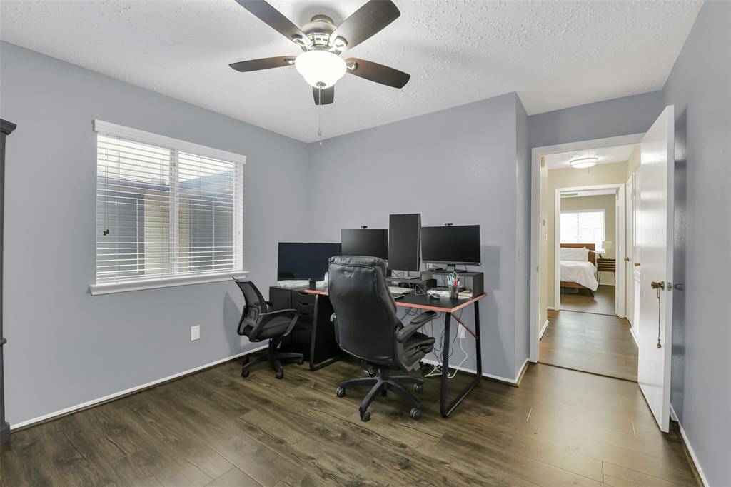 Third bedroom used as an office with natural light flowing in
