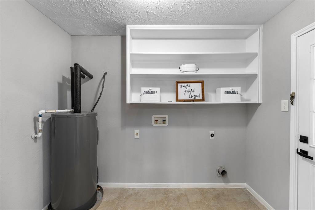 washer dryer room next to kitchen