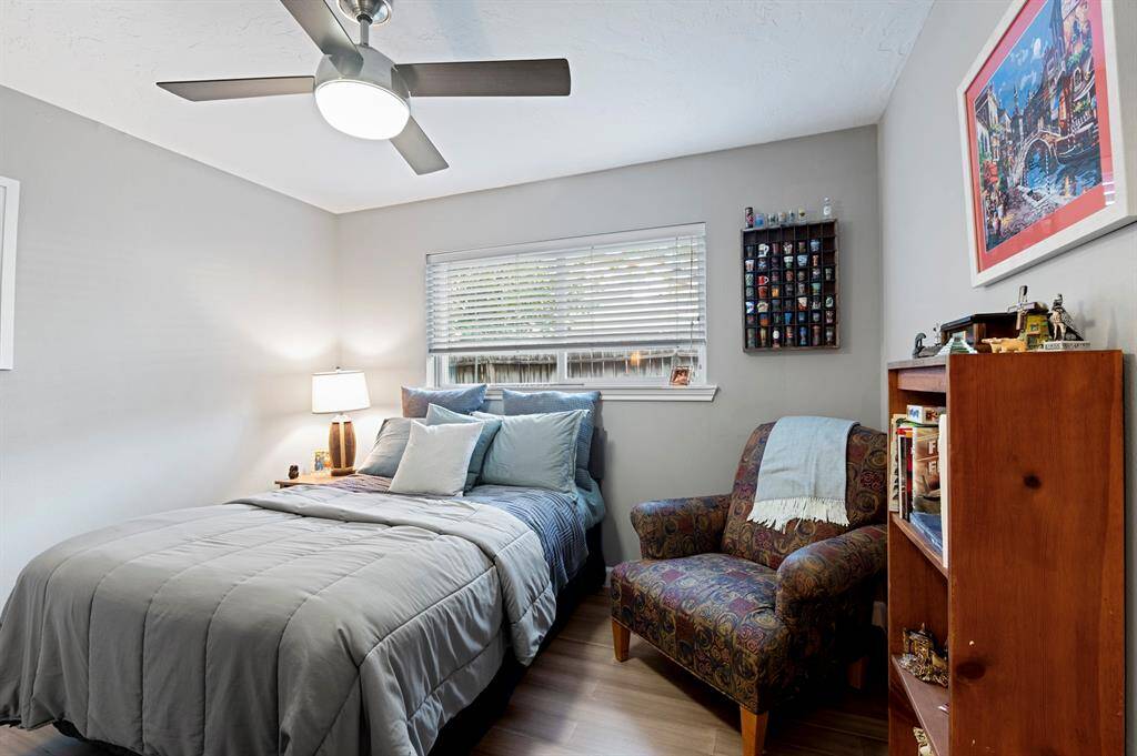 One of three spacious bedrooms, offering comfort and versatility for your needs.
