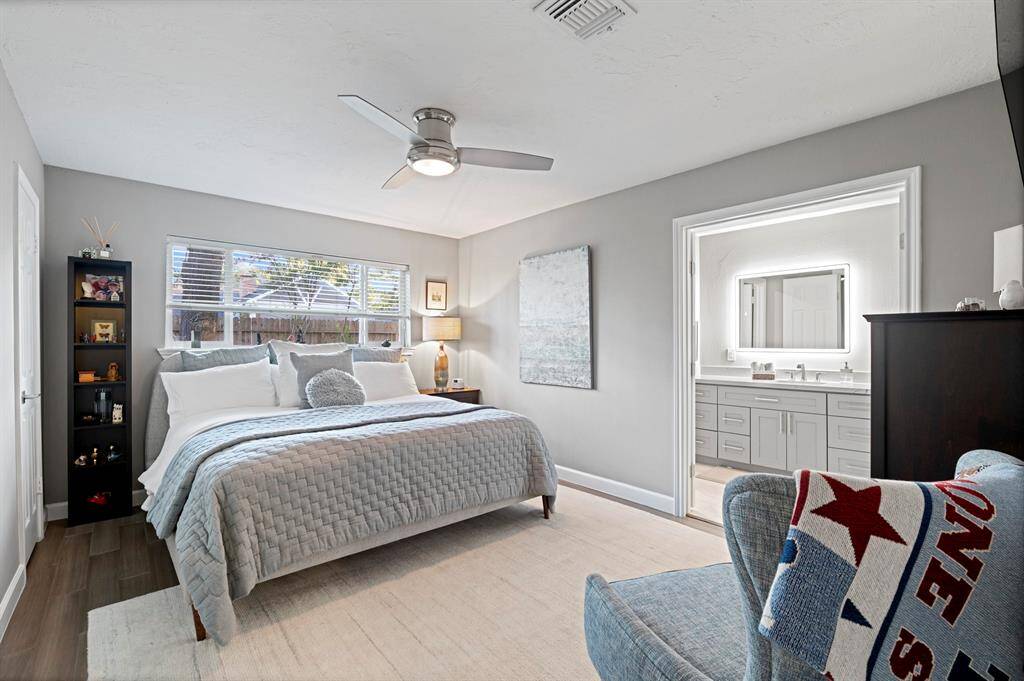 Spacious primary bedroom with abundant natural light, creating a bright and inviting retreat