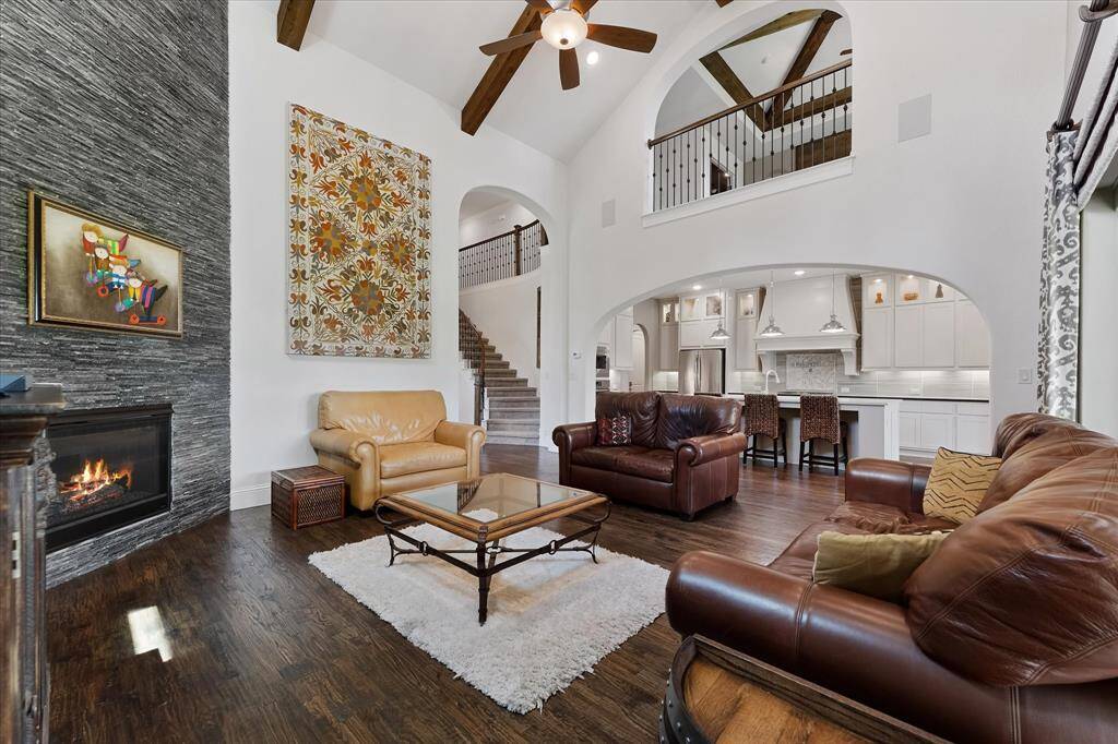 The living room is open to the kitchen and breakfast rooms for easy entertaining