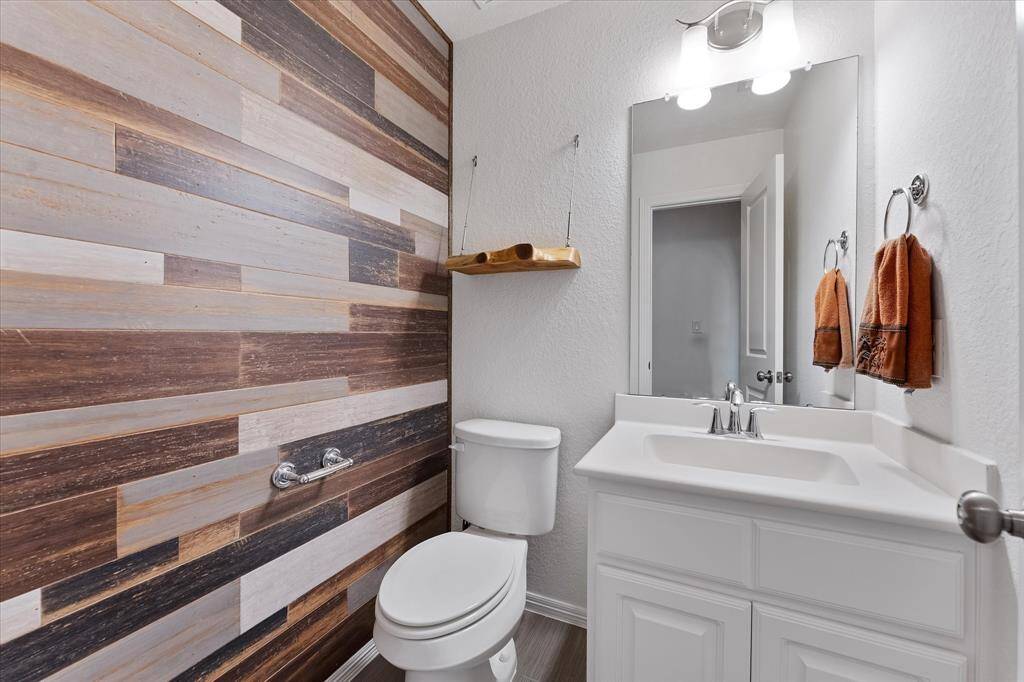 Guest powder room with accent wall