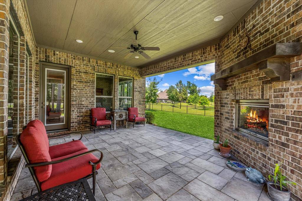 Relax on the covered patio and enjoy the fireplace on the chilly winter evenings