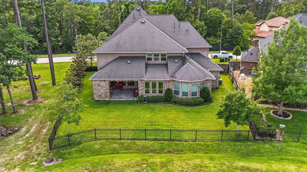 Aerial view of the back of the home and backyard