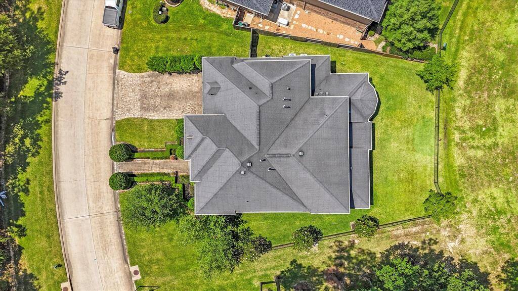 Aerial view of the home nestled on the lot