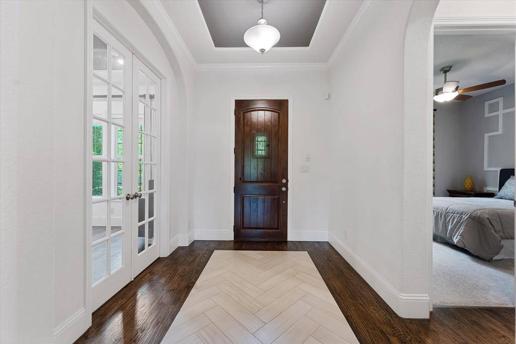 The home office and guest rooms are located off the entry