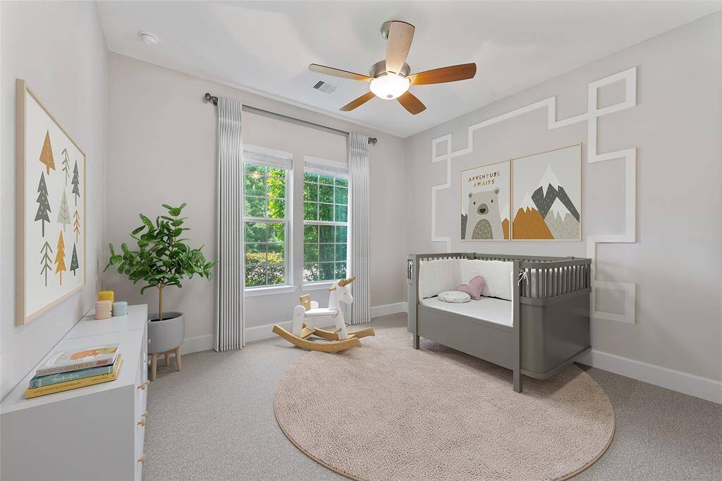 Guest bedroom down with ensuite bath. Virtually staged as the perfect place for a nursey also.