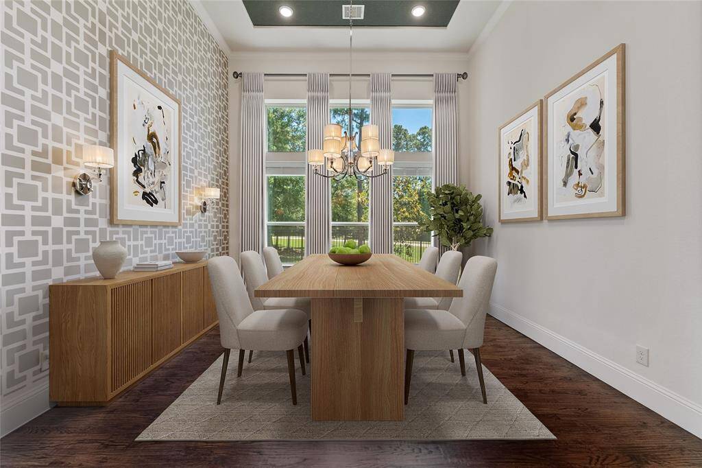 Stunning dining room with wall of windows for natural light. Virtually staged