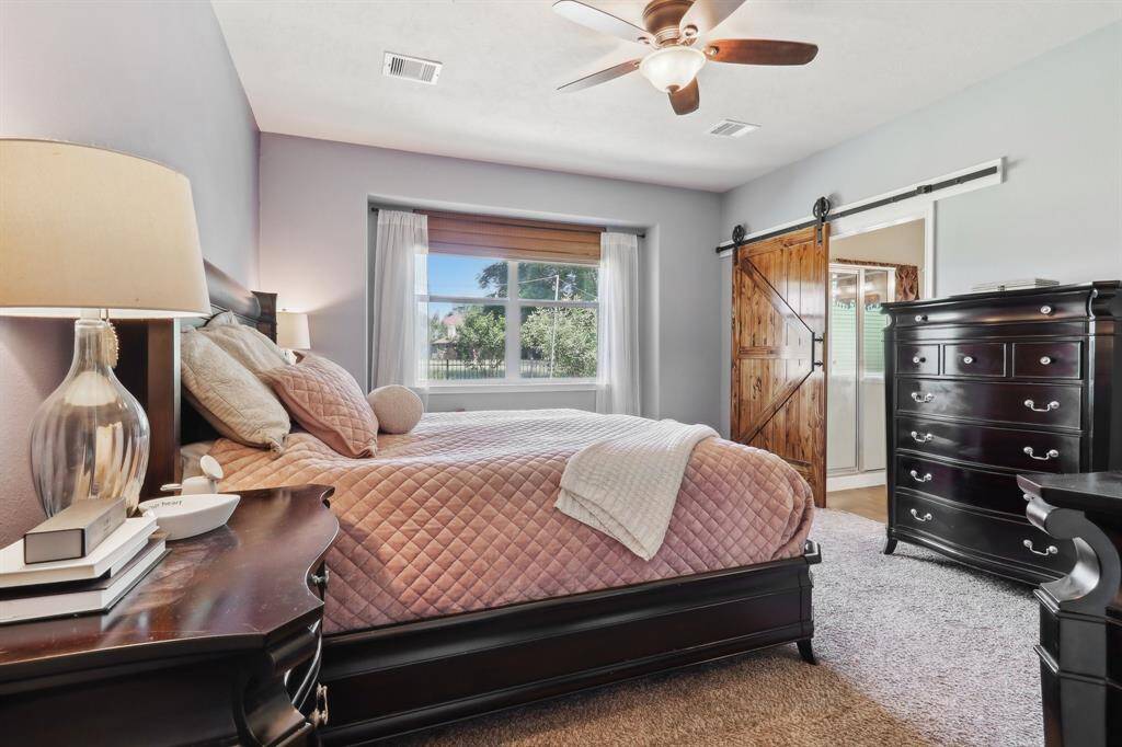 Lots of natural light in the primary bedroom and no neighbors behind you allows extra privacy.