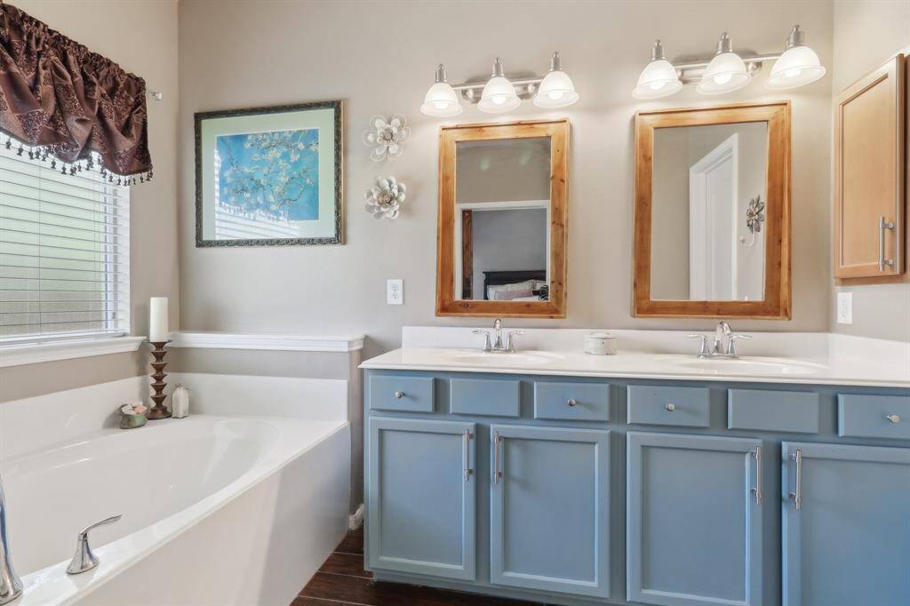 Double vanity with custom mirrors in the primary bath