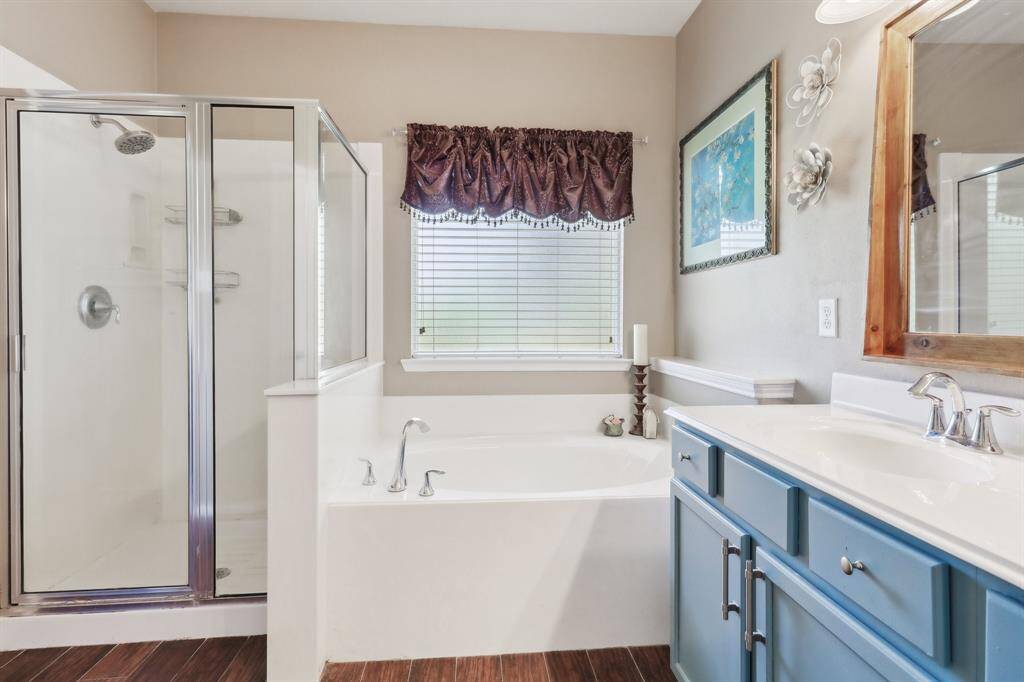 Separate shower and soaking tub to unwind and relax!