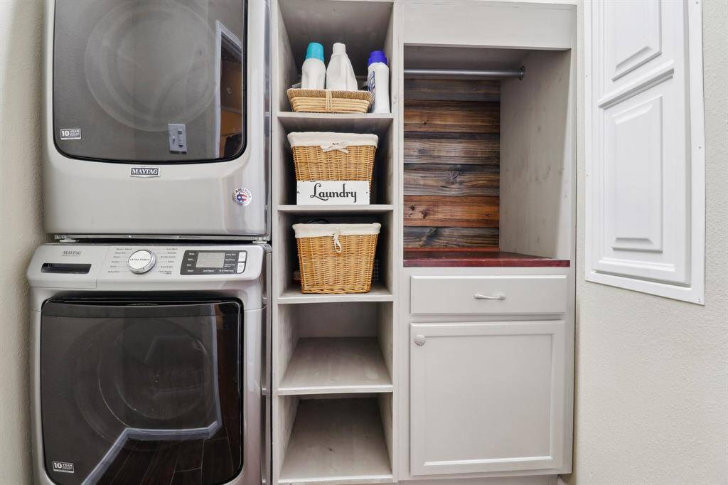 Laundry room with custom built-ins provide function and ease!