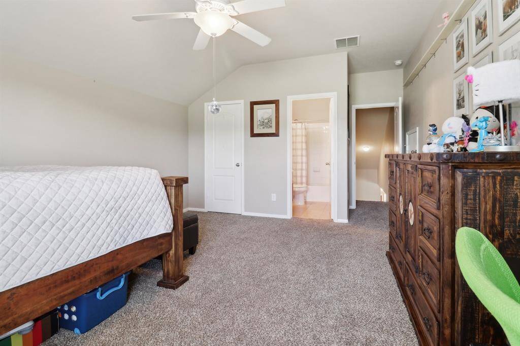 Second floor bedroom includes full bath and closet