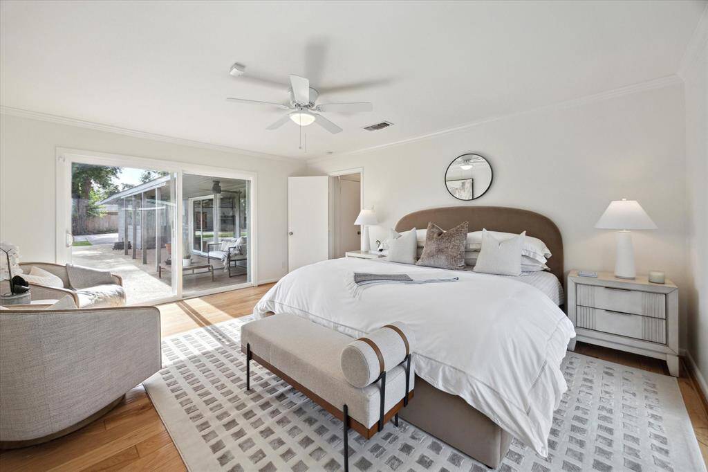 The primary suite is a true retreat, offering views of the pool and yard.