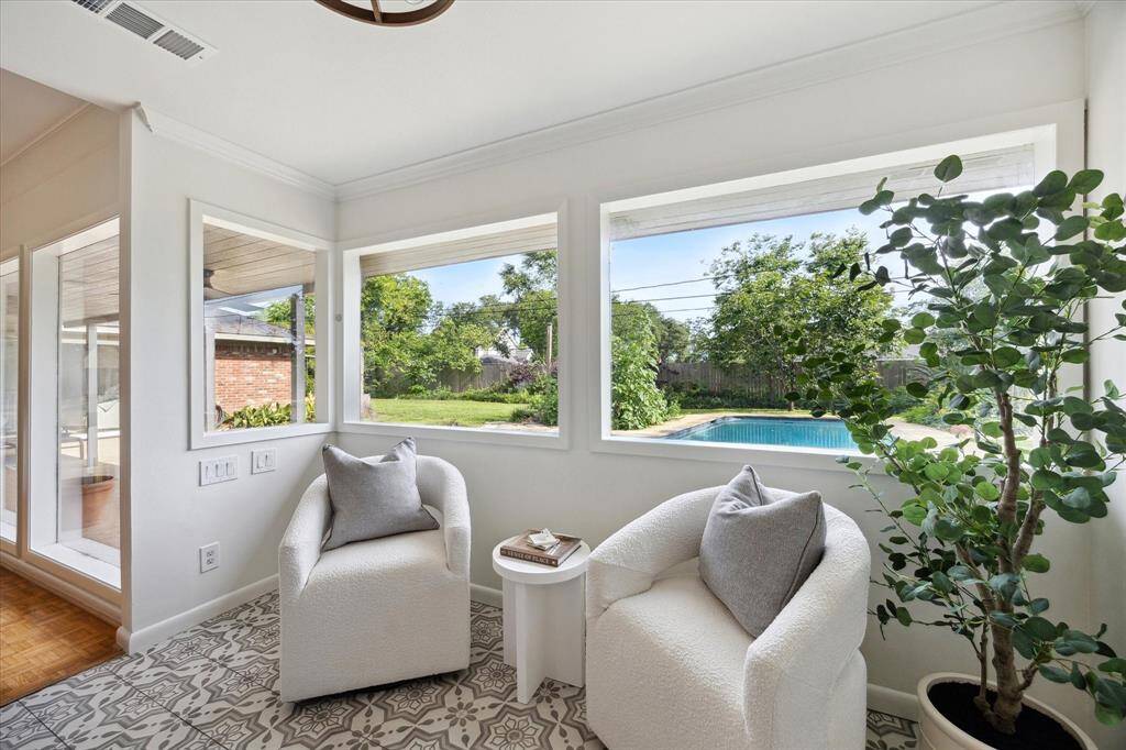 The seating area just off the kitchen is the perfect spot to unwind and enjoy your morning coffee.