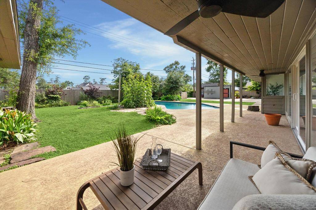Relax under the covered patio with ceiling fans while enjoying views of your loved ones running and playing.