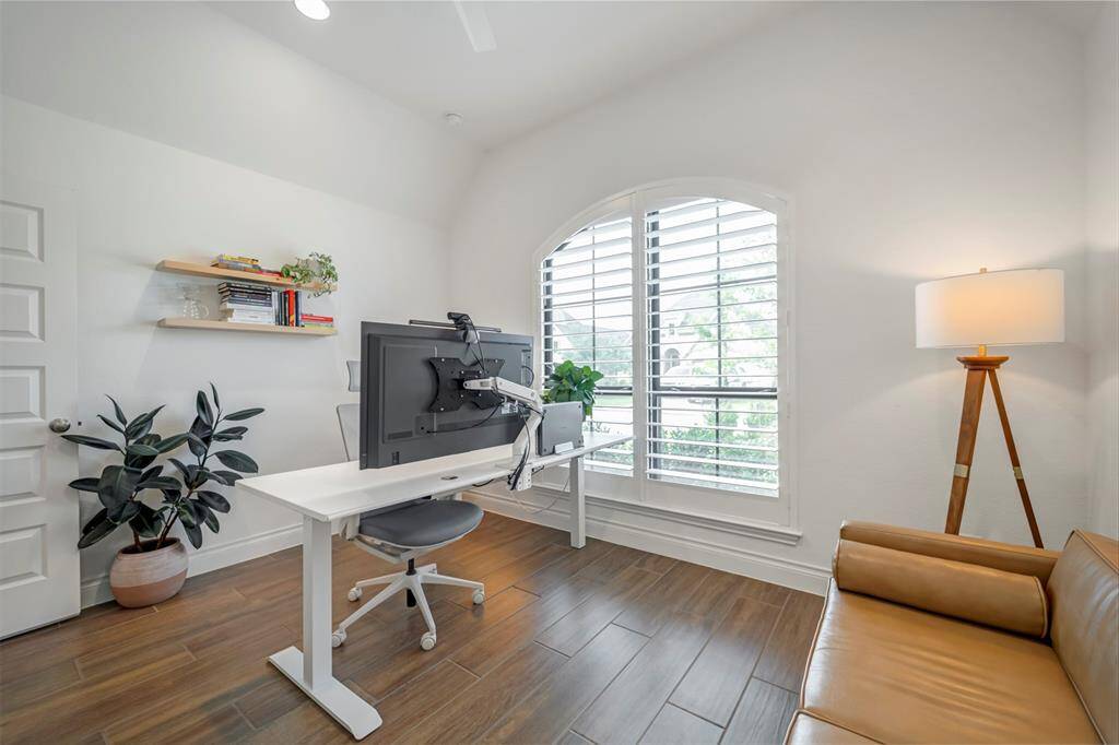 Secondary view of the 3rd bedroom featuring wood-look tile flooring.