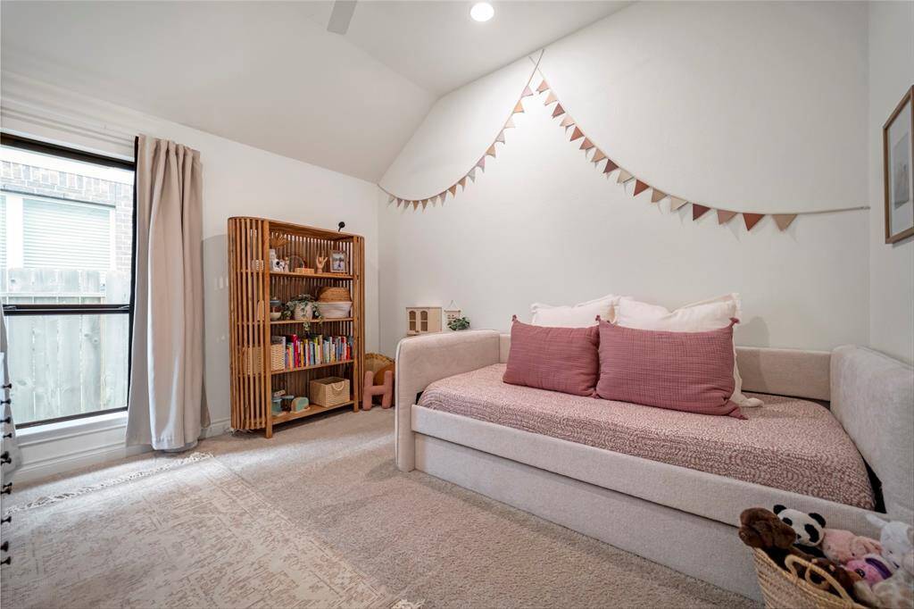 4th bedroom with angled ceiling detail and easy access to the hall bathroom.