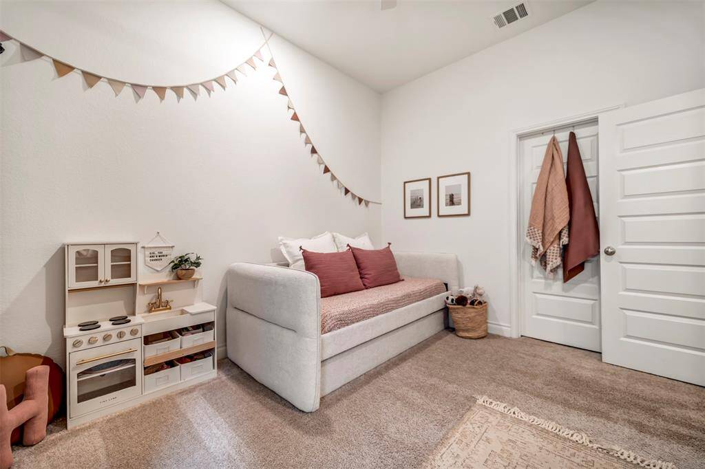 Upgraded hall bath with tile tub surround between the second and third bedrooms