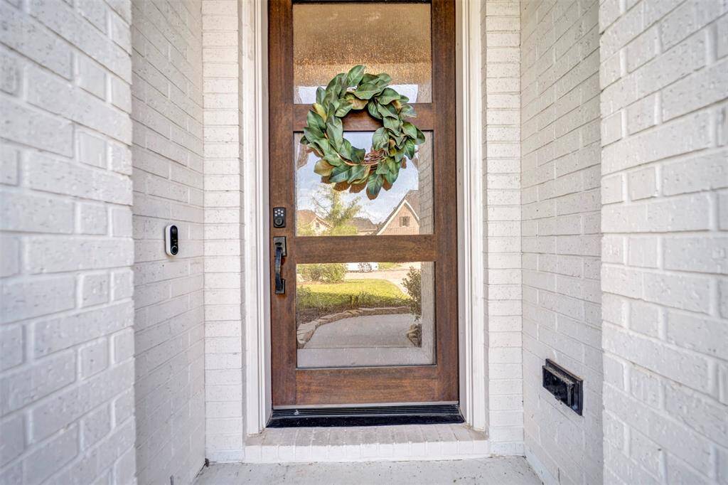 The beautiful modern front door makes a striking first impression.
