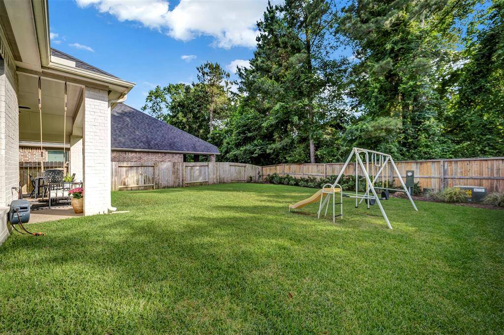 A secondary view of the backyard, featuring a mosquito control system integrated into the sprinkler system.