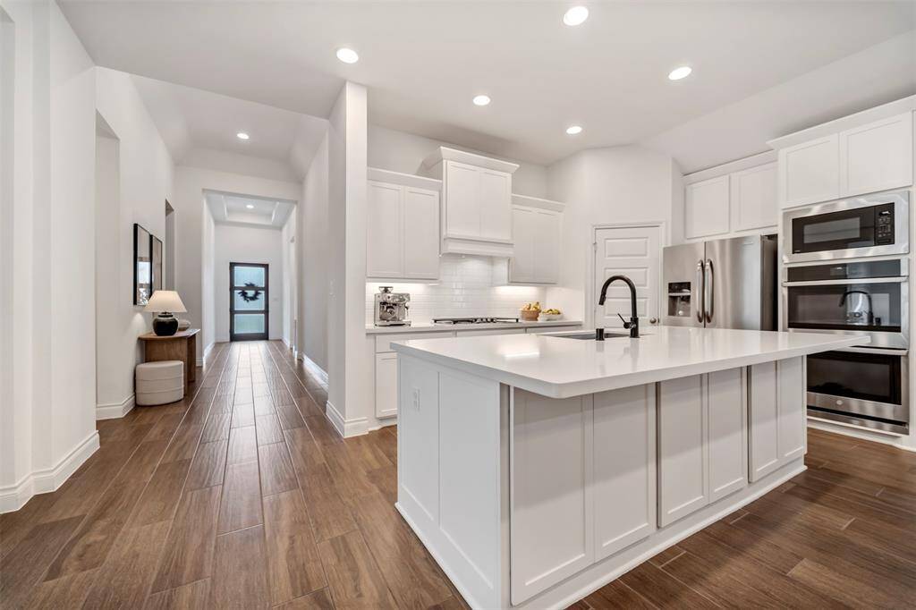An open floor plan provides full views of the foyer.
