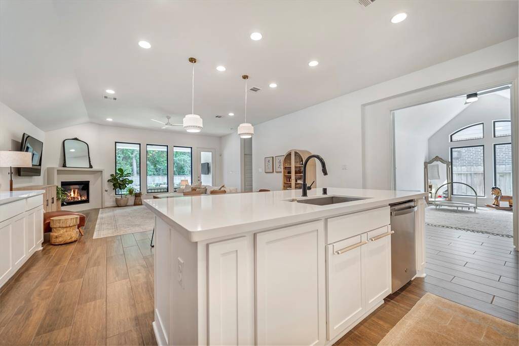 The kitchen offers a view into the family room and out to the backyard.