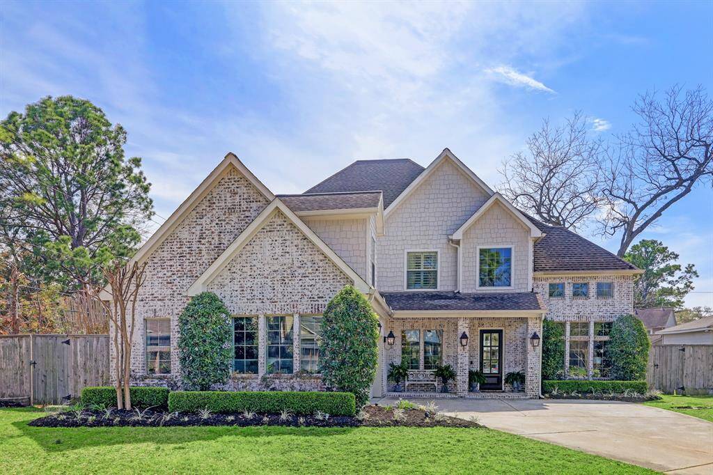 Wonderful curb appeal with stunning elevations, gas lanterns, covered front porch, shake and Hardi siding.