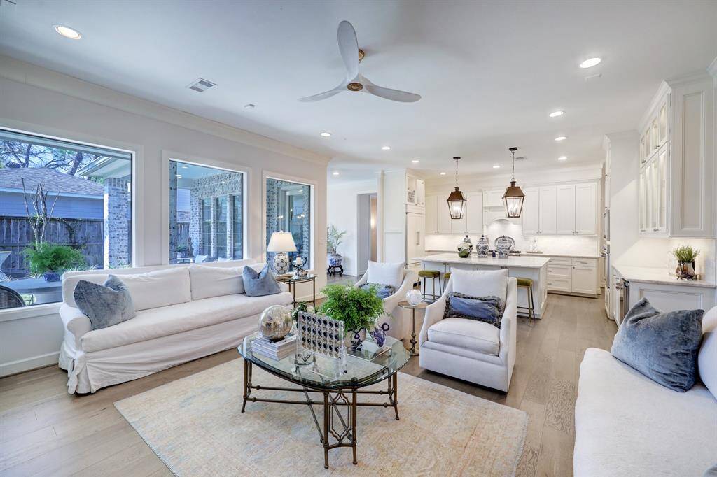 Spacious family room with wall of windows over looking the back yard and open to the kitchen.