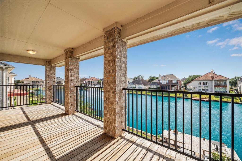 The covered porch runs the entire width of the home. Stunning views!