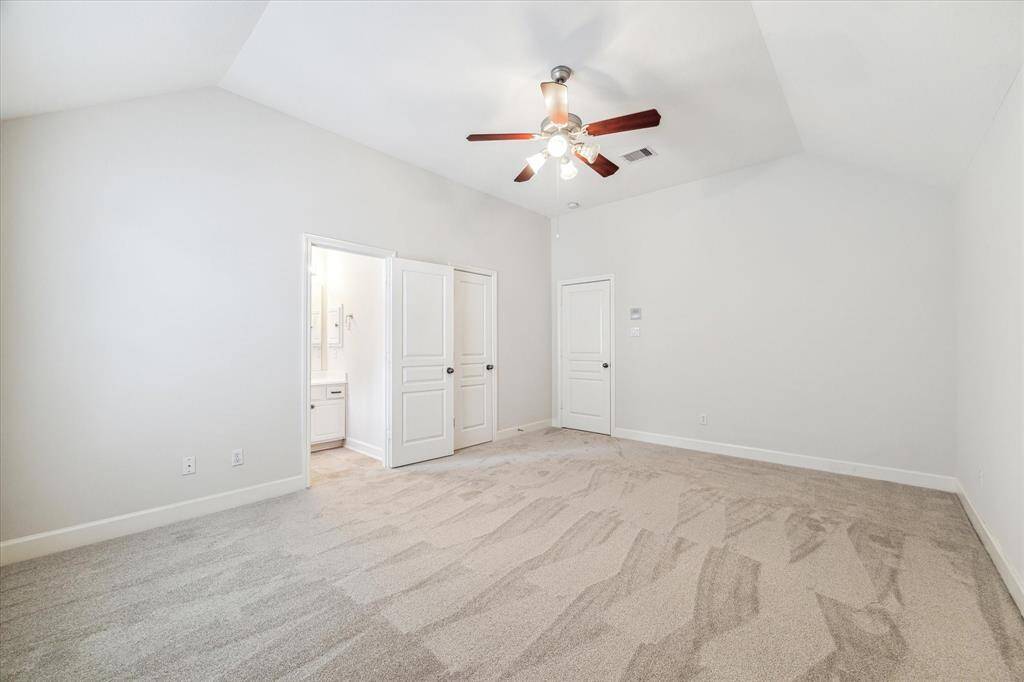 The first of three secondary bedrooms.  This one has an ensuite bathroom. New carpet!