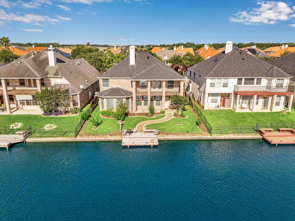 Beautiful two-story home with loads of upgrades including the paver driveway.