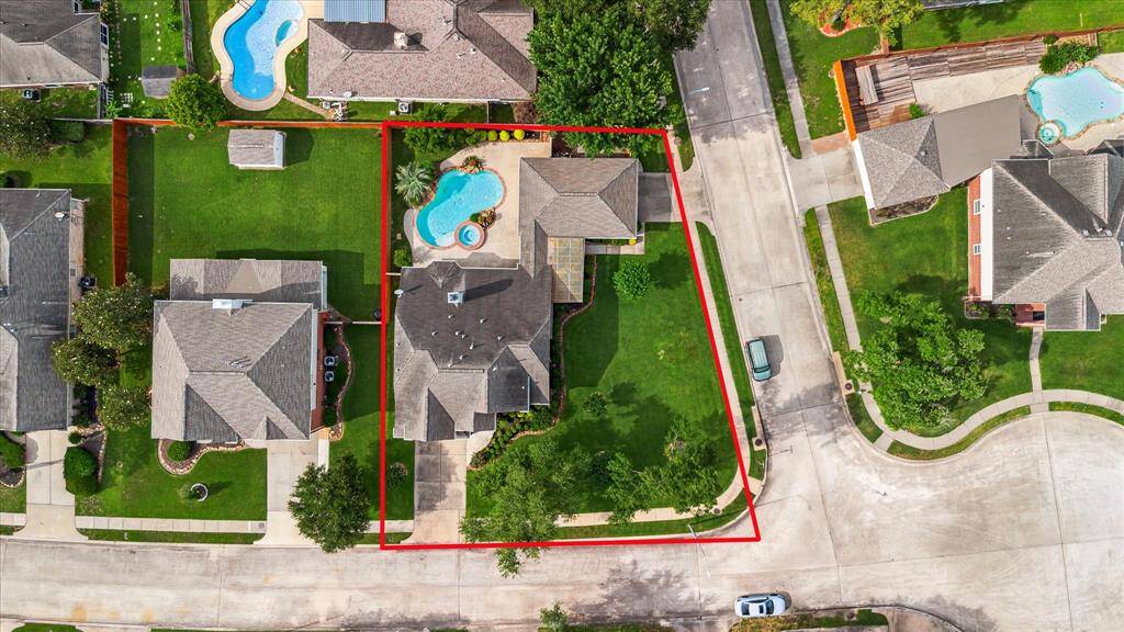 Long front driveway leading to your first garage with Beautiful Landscaping, second two car garage on the  side of home!!