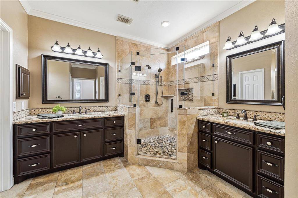 Remodeled Primary Bathroom with enlarged shower and two closets.