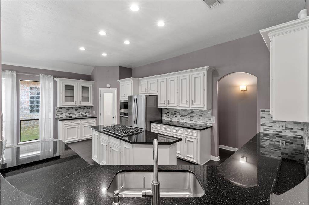 White cabinets and granite countertops