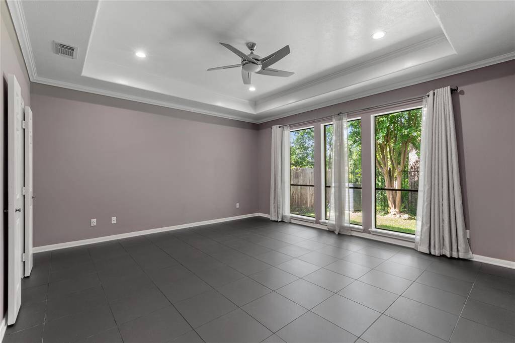Large primary bedroom with room for king size furniture