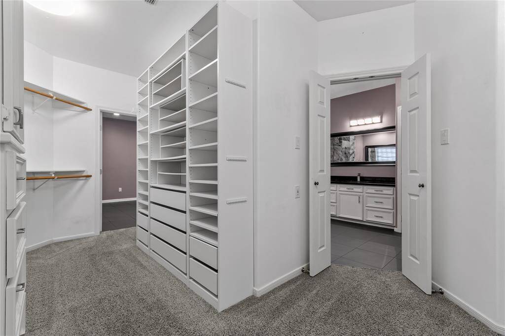 Huge walk in closet with added built in closet organization