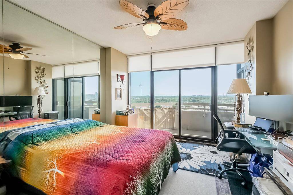 The large primary bedroom suite has access to the private balcony and includes a walk-in closet and ensuite bath.