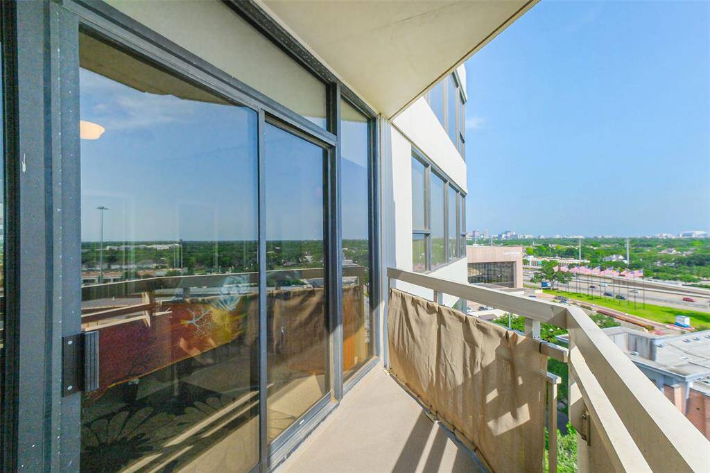 This high-rise home enjoys a private balcony accessed from the primary and secondary bedrooms.
