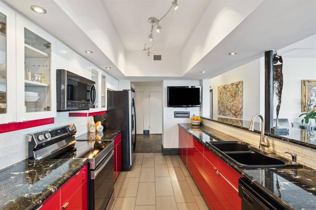 Kitchen open to the entry and dining room.